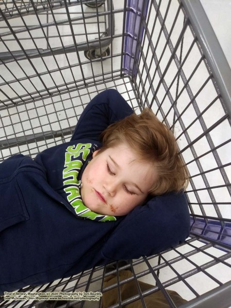 Sleeping in the cart at Winco: January 20, 2020: Renton, Washington. The Adventures of Sir Oisin Leif:  Saga 1 - Dual states at https://technotink.net/adventures/?page_id=2.  Photography by Sir Oisin Leif, Thomas Baurley, Leaf McGowan, Technotink.net/photography  (c) 2020. All rights reserved.