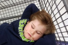 Sleeping in the cart at Winco: January 20, 2020: Renton, Washington. The Adventures of Sir Oisin Leif:  Saga 1 - Dual states at https://technotink.net/adventures/?page_id=2.  Photography by Sir Oisin Leif, Thomas Baurley, Leaf McGowan, Technotink.net/photography  (c) 2020. All rights reserved.
