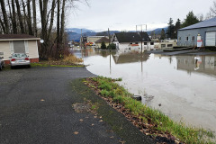 December 11, 2025: The Nooksack River / Sumas Washington Flood 2025. Southeast view along 2nd avenue. Adventures of Sir Thomas Oisin Rhymour. Photo copyright by Techno Tink Photography www.technotink.com/photography. (c) 2025: Thomas Baurley.  Permission and reprint/repost permission with attribution required. technotinkmedia@gmail.com.