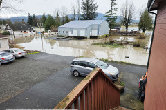 December 11, 2025: The Nooksack River / Sumas Washington Flood 2025. Southeast view along 2nd avenue. Adventures of Sir Thomas Oisin Rhymour. Photo copyright by Techno Tink Photography www.technotink.com/photography. (c) 2025: Thomas Baurley.  Permission and reprint/repost permission with attribution required. technotinkmedia@gmail.com.