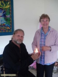 Oisin being given the flame