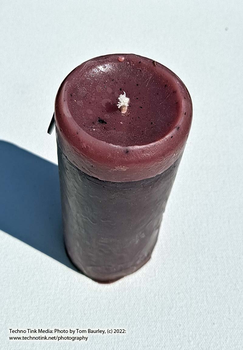 Small purple pillar candle with lavender scent