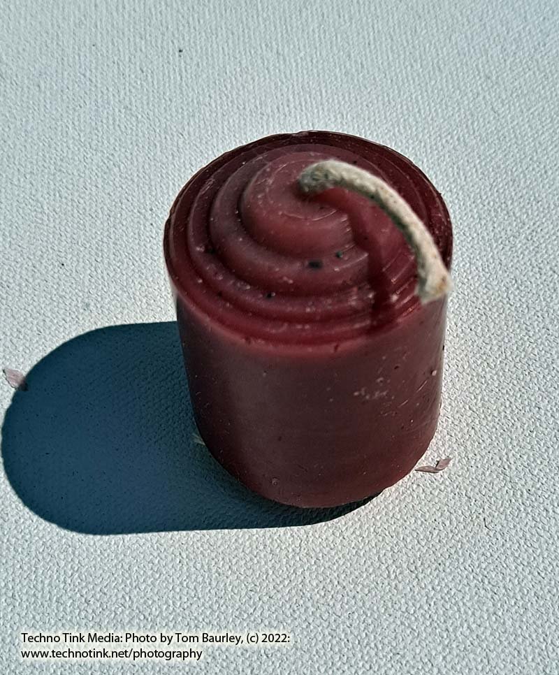 Small red votive candle