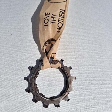 A Medal made from a bike gear and Love Thy Mother ribbon