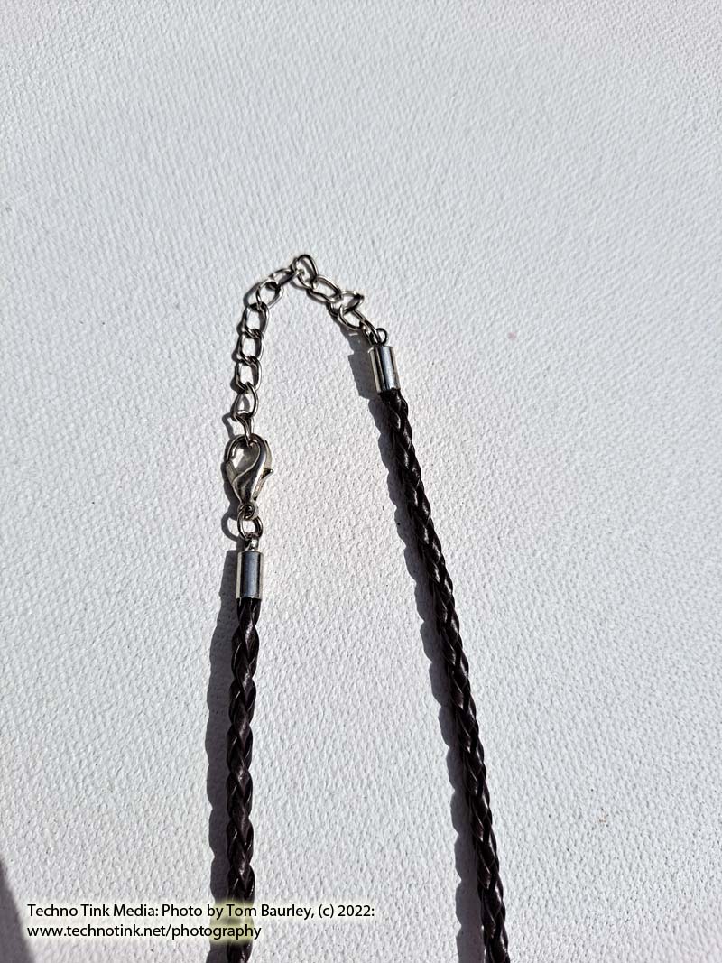 Glass vial with stopper pendant on brown braided leather cord necklace - Image 5