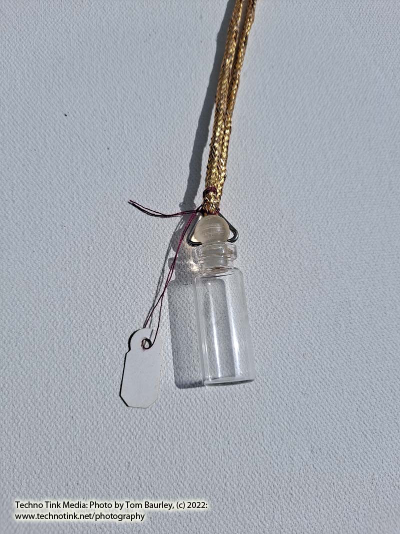 Glass vial with stopper pendant on gold color cord - Image 2