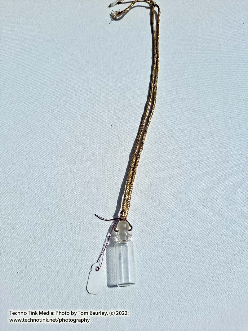 Glass vial with stopper pendant on gold color cord - Image 3