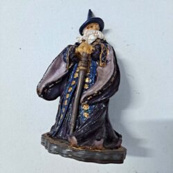 Small gazing Wizard with Staff on platform Figurine