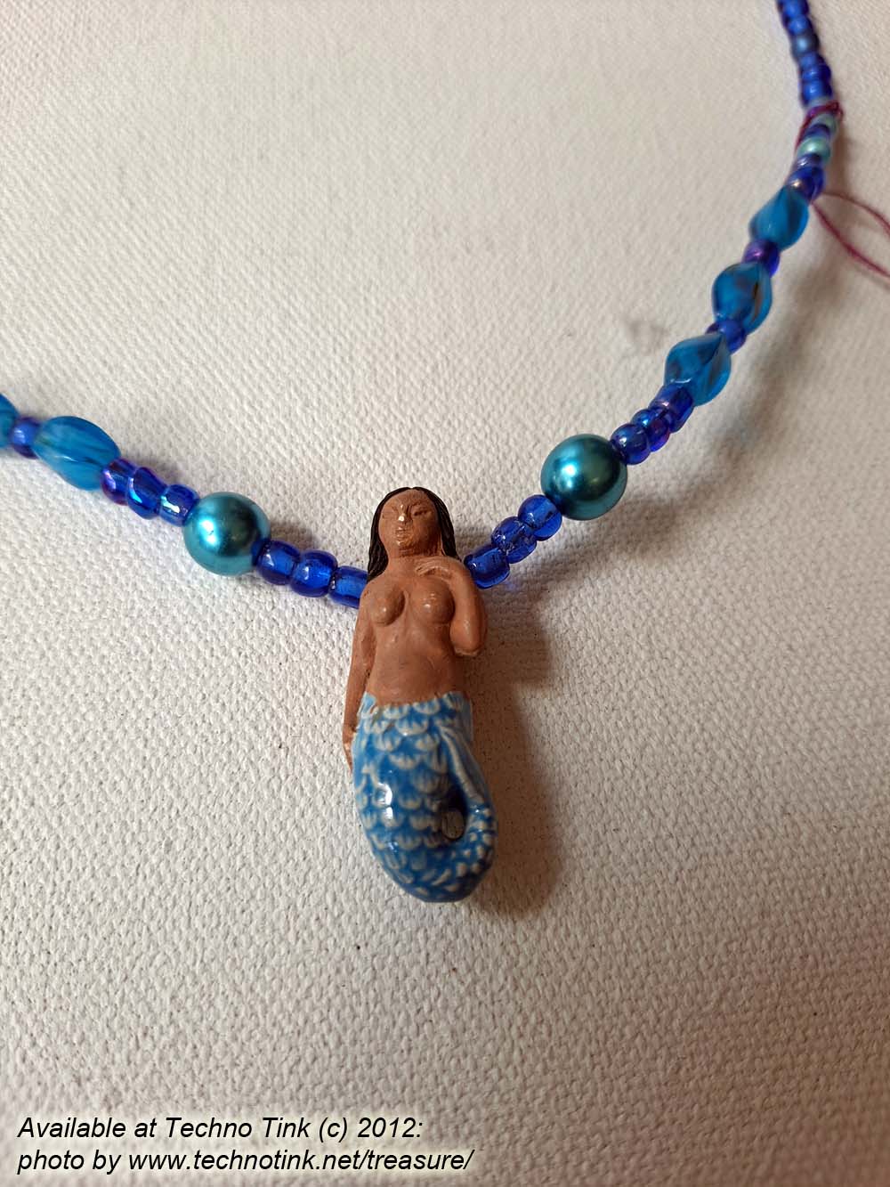 Black-haired dark skin Mermaid Clay Pendant on bright blue ball beaded necklace - Image 3