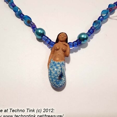 Black-haired dark skin Mermaid Clay Pendant on  bright  blue ball beaded necklace