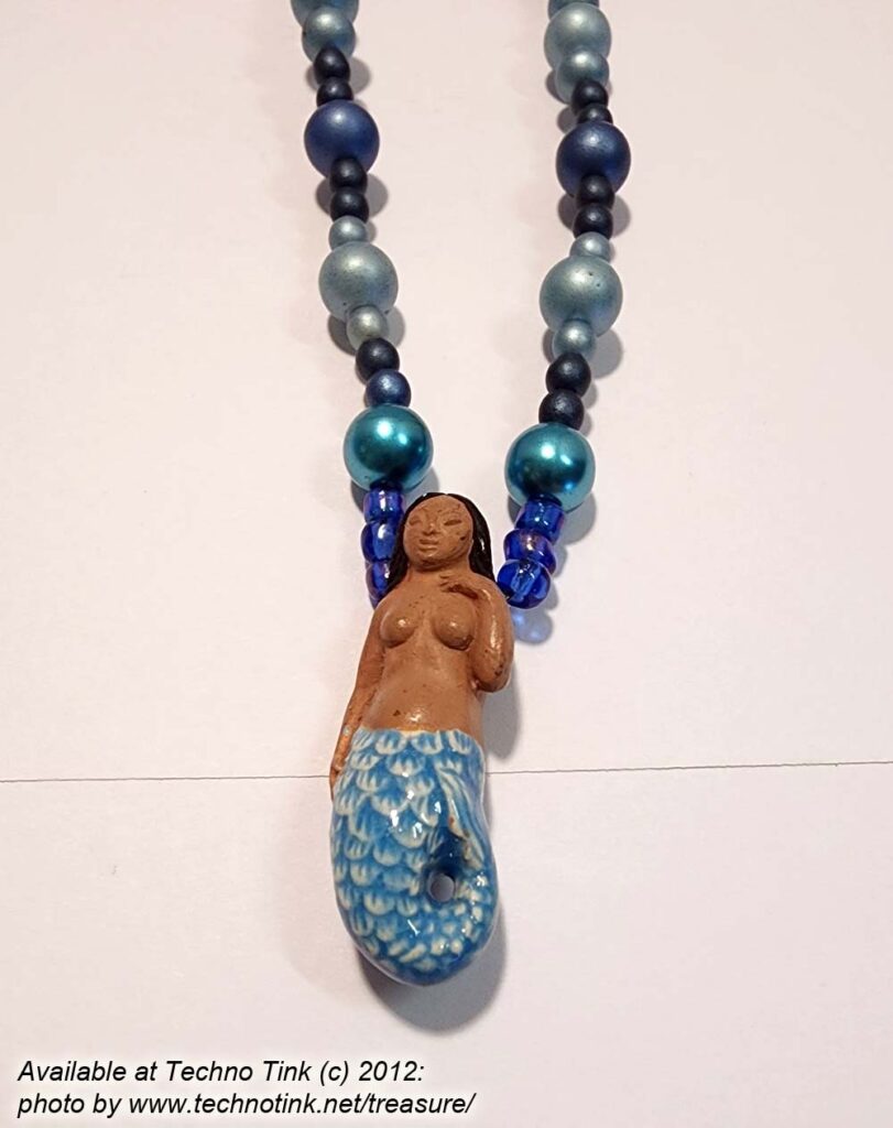 Black-haired dark skin Mermaid Clay Pendant on earth-tone dull blue ball beaded knecklace