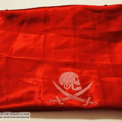 Shiny Red Scarf with solitary skull and swords emblem on it
